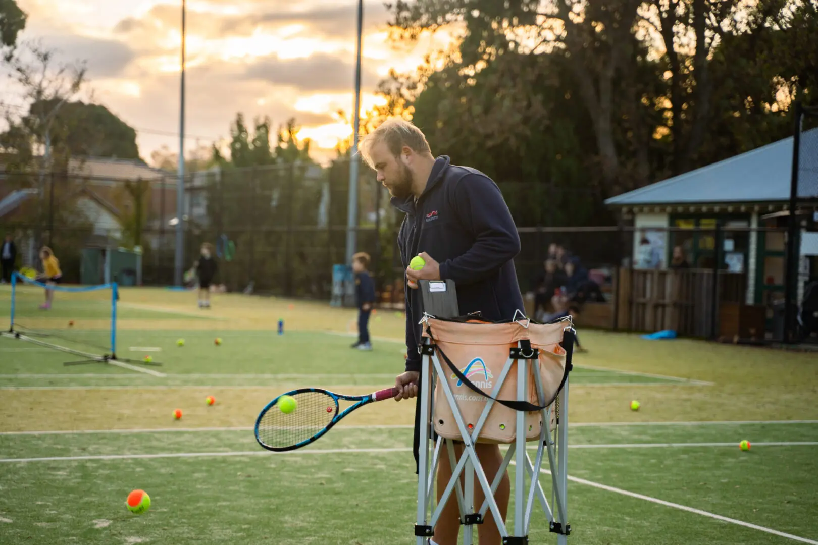 Sunny tennis court, senior tennis coach